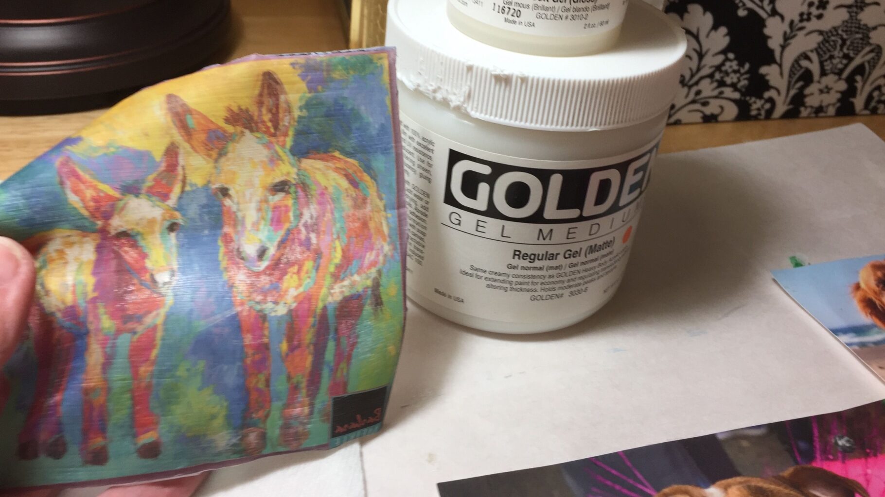 photo shows a tub of Golden Gel Medium and a colorful image transfer of two donkeys
